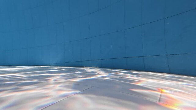 Sunlight Filtering Through Water and Creating Patterns on Pool Floor