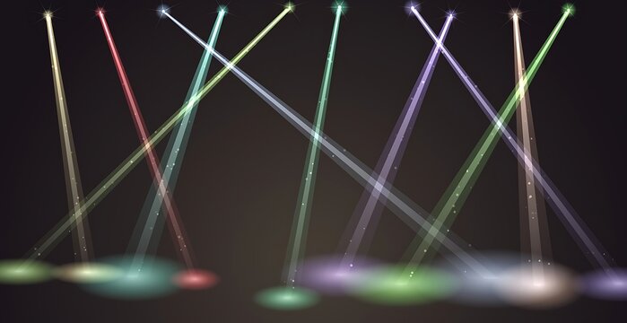 Colorful laser beams crossing in dark night sky setting