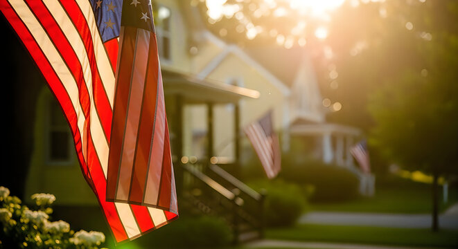 American flag waving in golden sunlight at outdoor event. Patriotic banner flying during summer festival or national holiday celebration.