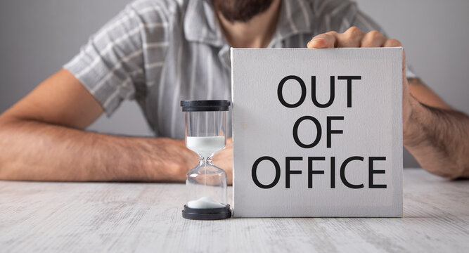 Man showing Out Of Office message.