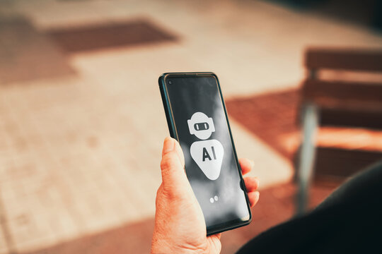 Mature woman using AI chatbot assistant on smartphone outdoors. AI technology adoption, digital assistants, and mobile innovation among older adults concepts.
