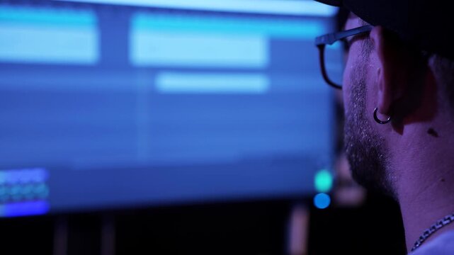 Composer Reviewing Music Session In Recording Studio