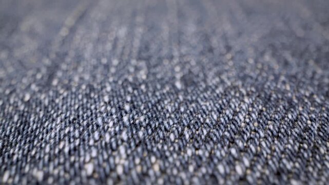 gliding macro view over blue denim fabric texture