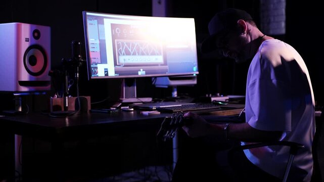 Professional Producer Working In Modern Home Recording Studio
