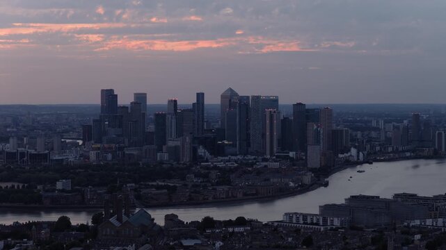 Aerial View of Canary Wharf Skyline and River Thames at Sunset in London, UK