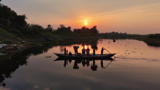 Silhouetted boat carrying workers and harvest on calm river at golden hour sunset serene rural