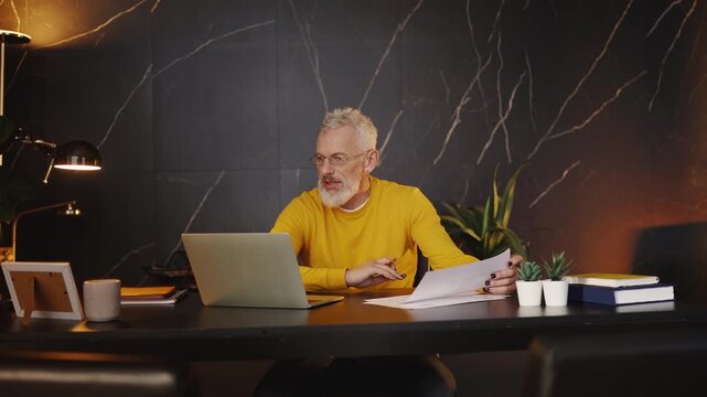 CEO of an AI company discussing ideas with colleagues during a laptop video call