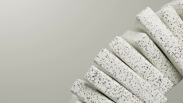 A stylish arrangement of speckled terrazzo blocks turning diagonally, providing clean copy space for product display and background design.