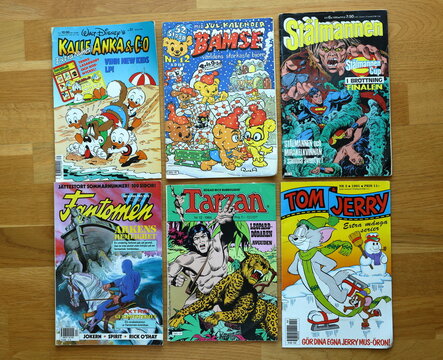 A pile of comic books. Donald Duck, Tom and Jerry, The Phantom, Superman, Tarzan and more. Swedish text. From the 1980 and 1990s.