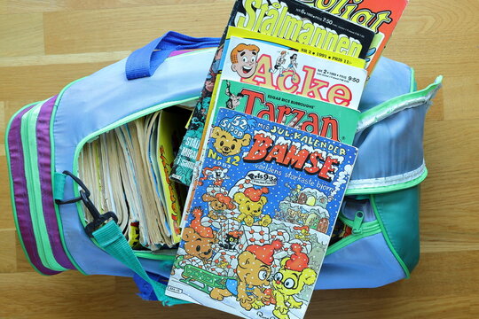 A pile of comic books. Bamse, Tarzan, Archie, Superman and more. Swedish text.
