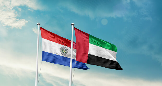 Paraguay and UAE friendship flags are waving in the sky. Double country Flag waving with mast. Paraguay UAE national flag for agreement.