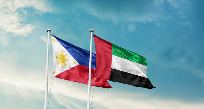 Philippines and UAE friendship flags are waving in the sky. Double country Flag waving with mast. Philippines UAE national flag for agreement.