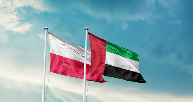 Poland and UAE friendship flags are waving in the sky. Double country Flag waving with mast. Poland UAE national flag for agreement.