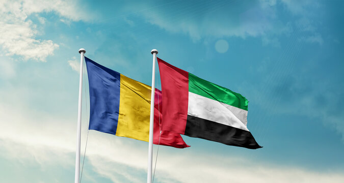 Romania and UAE friendship flags are waving in the sky. Double country Flag waving with mast. Romania UAE national flag for agreement.