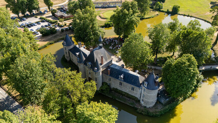 Aerial view of a moated chateau with turrets © Thomas