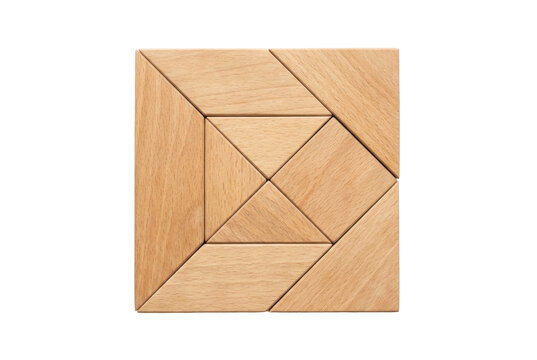 Square wooden tangram geometric dissection puzzle on black background.