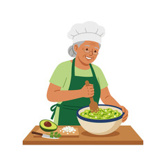 Senior woman chef preparing guacamole with avocado in a kitchen