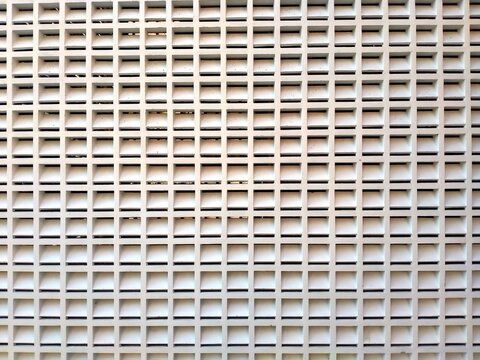 White Ventilation Block Wall with Repeating Geometric Openwork Pattern