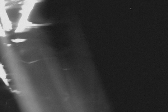 light leak overlay effect with scratch dust and blur light leaks,retro noisy film texture light leak flare on black background,abstract black and white background with red bokeh,grunge film strip