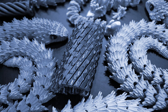 Art models printed on 3D printer. Different objects created on 3D printer from molten plastic. 3D printed different objects. Modern new modern additive progressive technologies. 3D printing technology