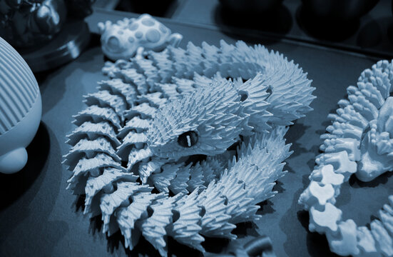 Art models printed on 3D printer. Different objects created on 3D printer from molten plastic. 3D printed different objects. Modern new modern additive progressive technologies. 3D printing technology
