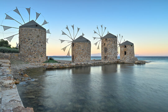 Ancient windmills of Chios Island, Greece at sunset
