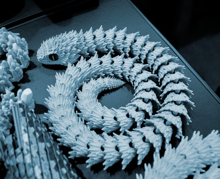 Art models printed on 3D printer. Different objects created on 3D printer from molten plastic. 3D printed different objects. Modern new modern additive progressive technologies. 3D printing technology