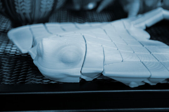 Art models printed on 3D printer. Different objects created on 3D printer from molten plastic. 3D printed different objects. Modern new modern additive progressive technologies. 3D printing technology