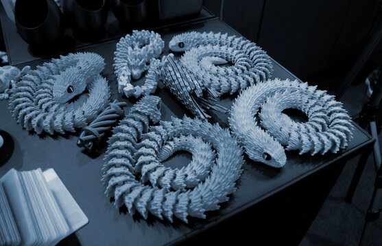 Art models printed on 3D printer. Different objects created on 3D printer from molten plastic. 3D printed different objects. Modern new modern additive progressive technologies. 3D printing technology