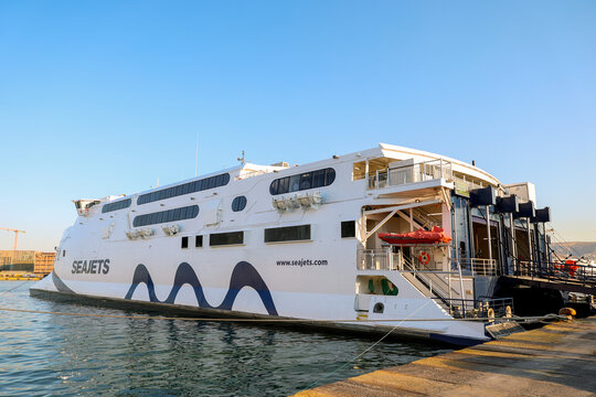 A SeaJets ferry docks at the busy Athens, Greek port, showcasing maritime transportation across the Aegean and the company&rsquo;s role in connecting the Cyclades islands.