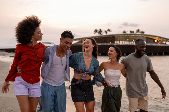 Friends traveling together, embracing adventure, laughter and unforgettable beach fun during a trip