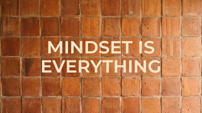 Mindset is everything quote written on a rustic terracotta tiled wall background