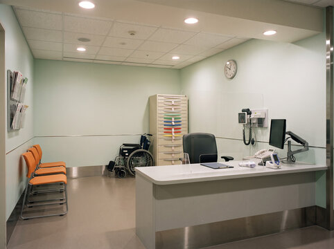 Empty er triage booth with sealed tag cabinet wide cinematic establishing shot photorealistic empty
