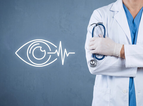 Medical professional with stethoscope. Healthcare worker in a clinical setting. Female doctor wearing a white coat and blue scrubs, holding a steth...