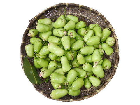 Fresh green water apples in a woven basket. Tropical wax apples isolated on Transparent background.