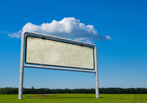 Advertising. Blank roadside billboard stands in an open field with copy space for outdoor marketing, branding, promotional campaigns and commercial messages. 3D image