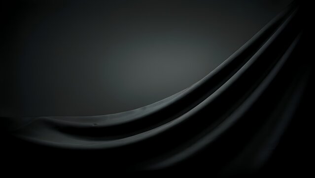 Dark gray draped fabric with flowing curves a monochromatic composition
