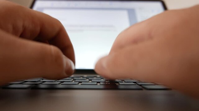 4K Typing on a Laptop Point of View Low Angle Wide Shot
