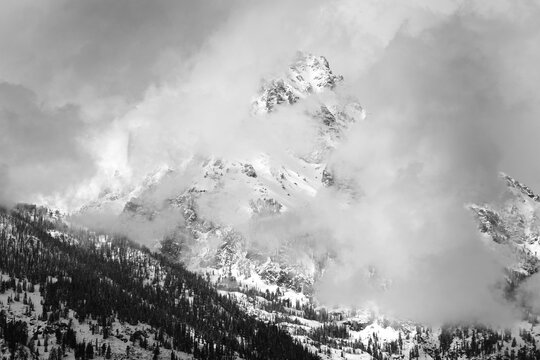 View of the Teton Mountain Range Grand Teton Mountains in Winter Snow Storm Snowstorm with Clouds Dramatic Wilderness
