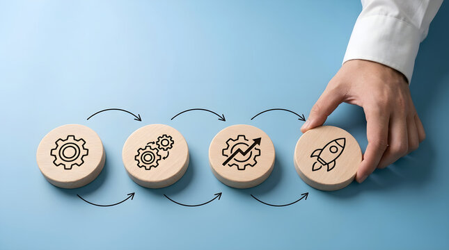 Business Workflow Optimization Concept with Hand Placing Wooden Discs on Blue Background
