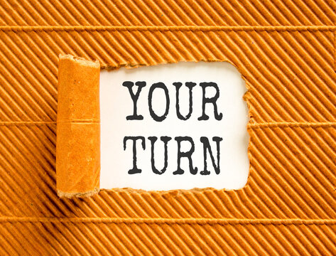 Your turn words symbol. Concept words Your turn on beautiful white paper. Beautiful brown background. Business your turn motivational support concept. Copy space.