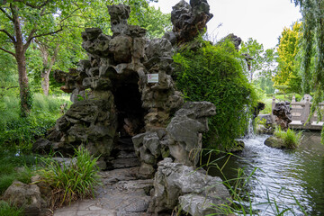 Obraz premium Artificial rock grotto with waterfall at Luisenpark