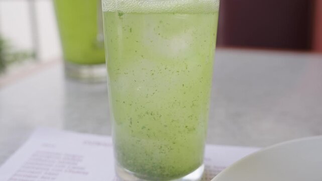 Close up of a refreshing lemon with mint juice, a typical arab drink, fizzing in a glass