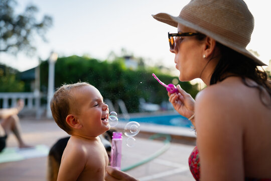 Mother blowing bubbles