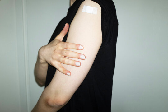 Conceptual image of person has taken the vaccination & having plaster