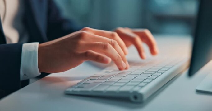 Close up of corporate employee typing on a white keyboard in office
