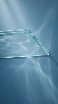 Clear glass tray in blue water with light refractions
