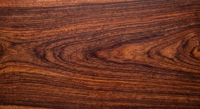 The natural texture of the rosewood surface background
