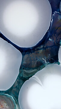 Art created with alcohol ink and epoxy resin on a smooth surface