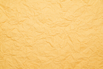 Fototapeta premium crumpled orange paper as texture background